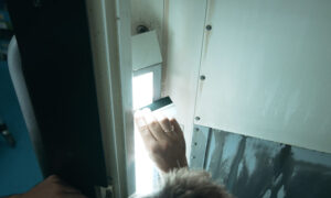 Technician performing light inspection with Insight KB transparency testing tool